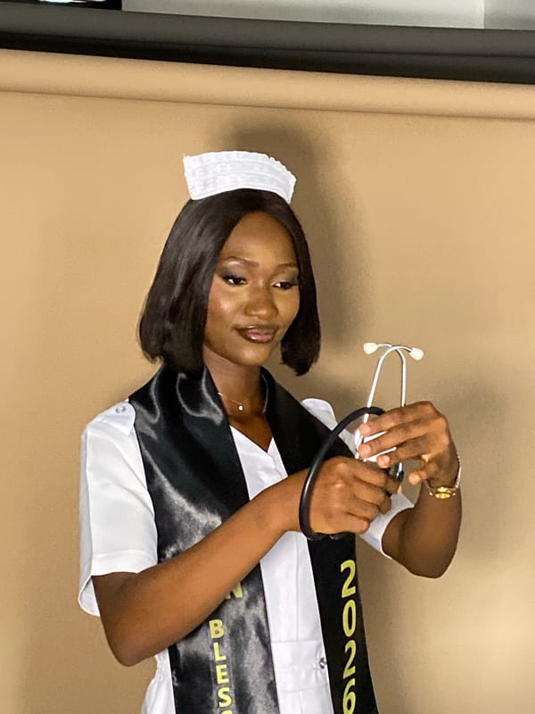 Nursing graduate poses for formal portraits in Nigeria studio
