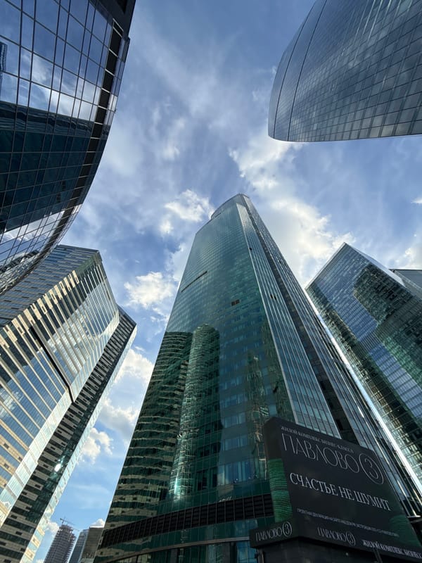 Modern glass towers in Khimki, explored from street level