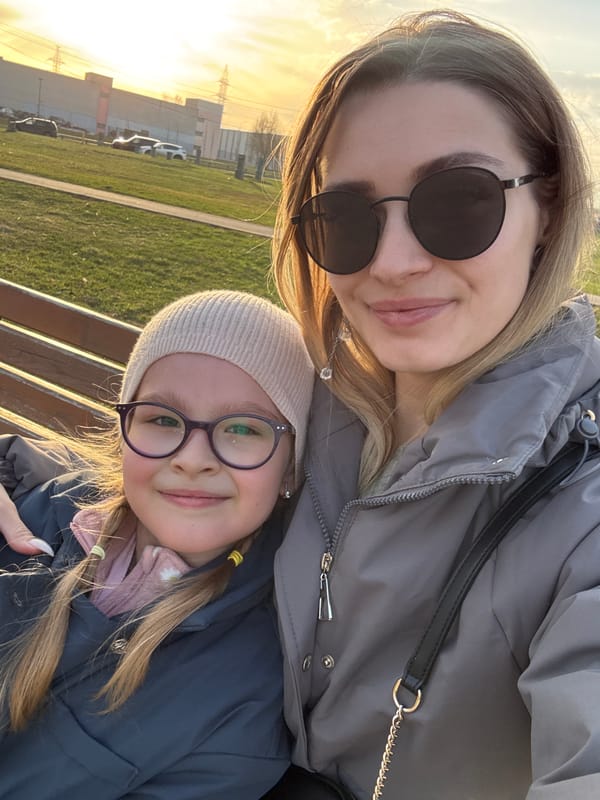 Woman and child enjoy afternoon outing in Moscow park
