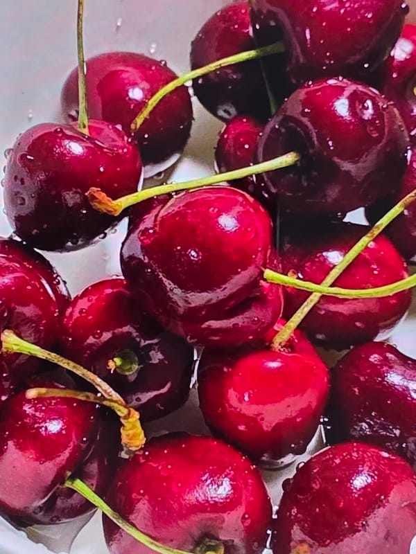 Fresh fruit preparation with cherries and sugared strawberries