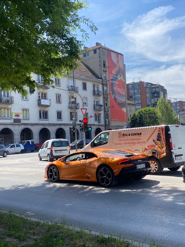 Orange Lamborghini spotted on Subotica street near advertising van