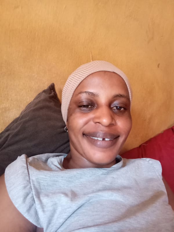 Woman takes selfies at home in Narayi, Nigeria