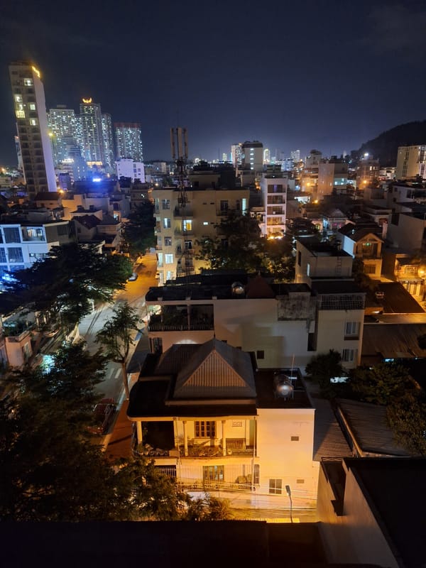 Nha Trang city lights and skyline under a full moon