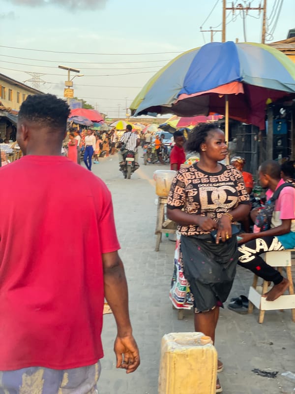 Daily street commerce unfolds across Lagos neighborhoods during evening hours