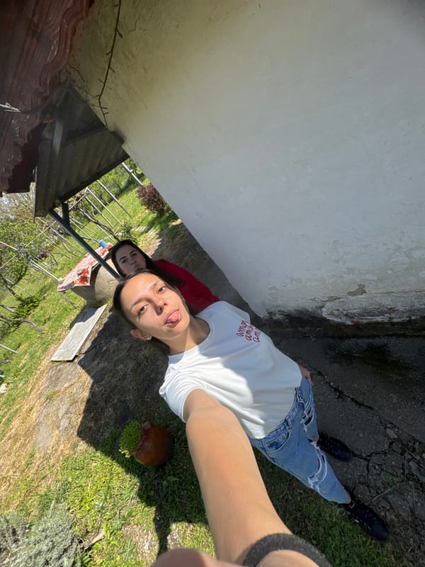 Woman takes selfies in rural Drenovets, Bulgaria vineyard area