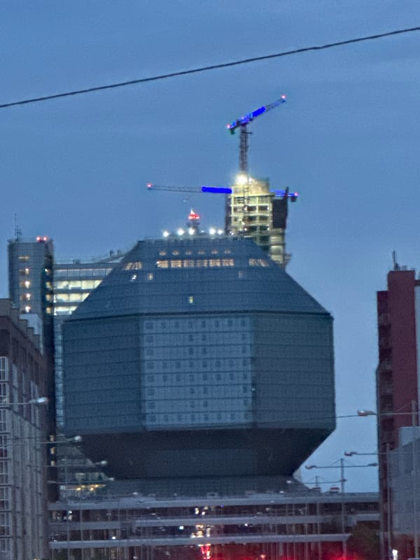 Evening scenes documented across Minsk including library, buildings, helicopter