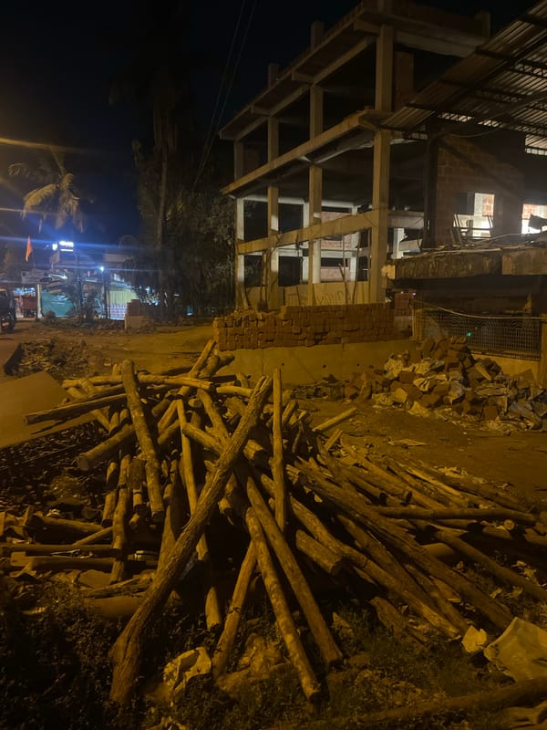 Construction site with building materials documented in Kudal