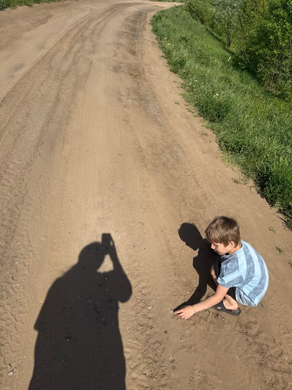 Family explores rural Уральское countryside during spring morning outing