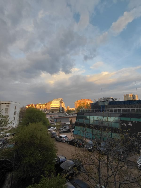 Observer documents Sofia cityscape during sunset hours