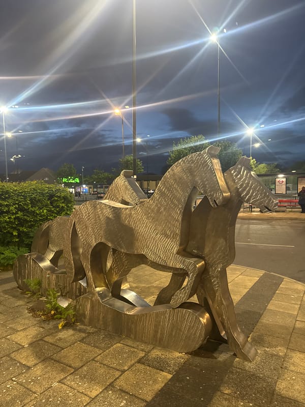 Large metallic sculpture observed on London street at night