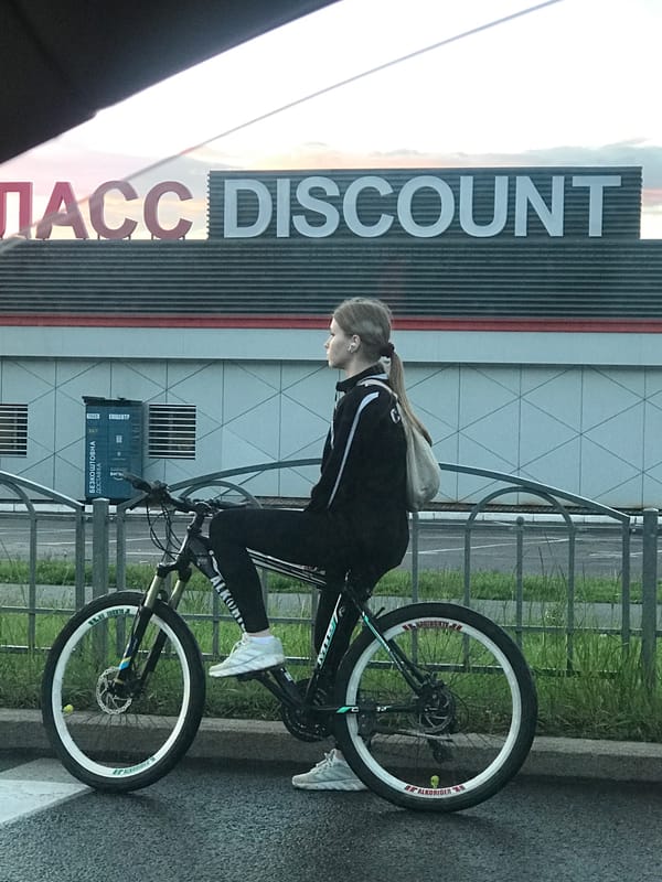 Cyclist spotted riding black bicycle on Kharkiv sidewalk