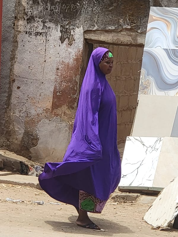 Daily street commerce unfolds in Maiburiji, Nigeria morning hours