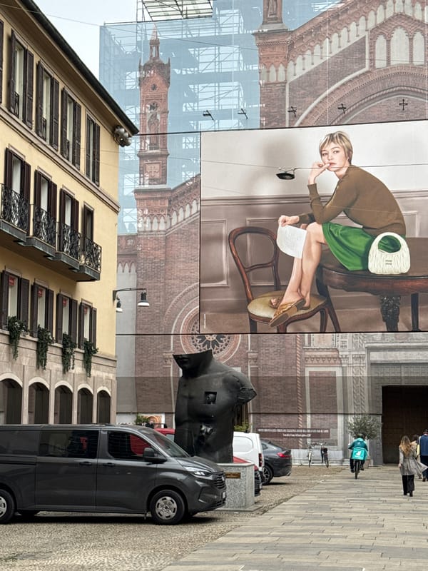 Milan building renovation documented with prominent banner display