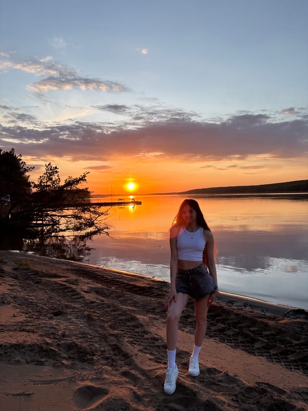 Sunset gathering captured along Kama River beach in Chaykovsky