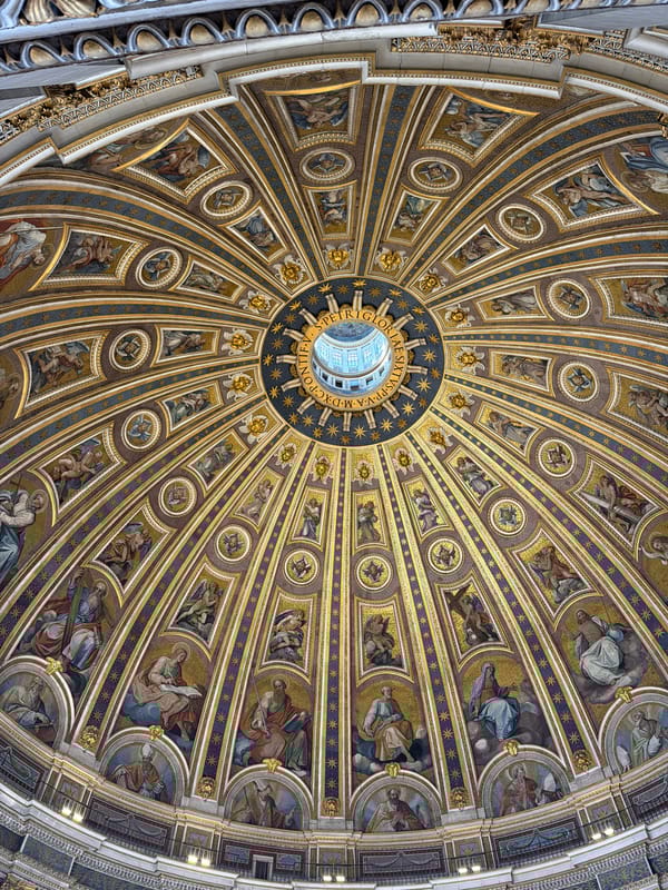 Visitor photographs ornate dome interior at St. Peter's Basilica