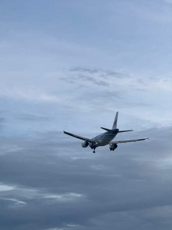 Ko Samui morning: beaches, a Buddhist temple, and a landing plane