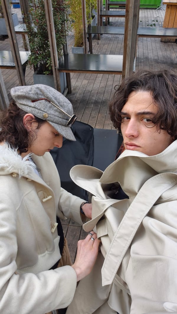 People gather on urban deck, one examines bag contents