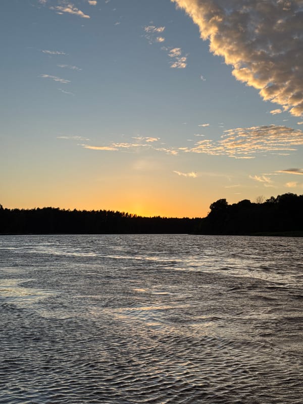 Gauja River sunset paints the Carnikava sky orange and blue