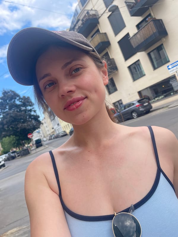 Tourist takes selfies on Vienna street Wednesday morning