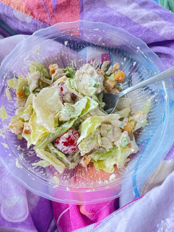 Morning meal observed in Saint Petersburg featuring salad and beverage