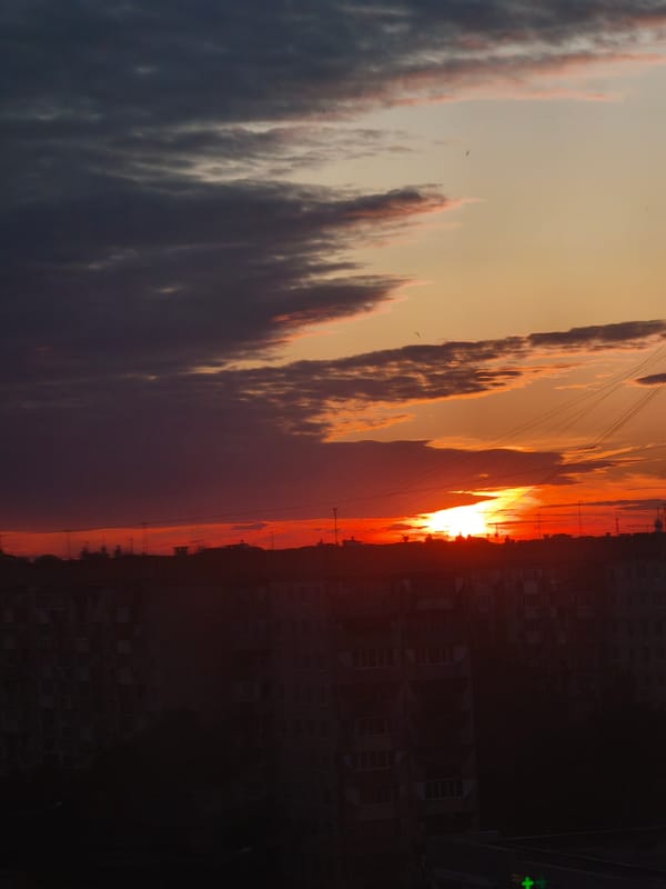 Dramatic sunset illuminates Yoshkar-Ola as evening life unfolds