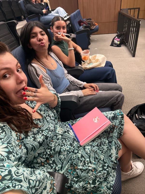 Young women rest in Mexico City theater seats