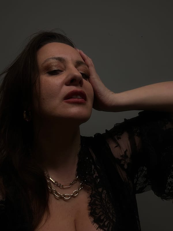 Portrait session captured in Riga featuring woman in black lace