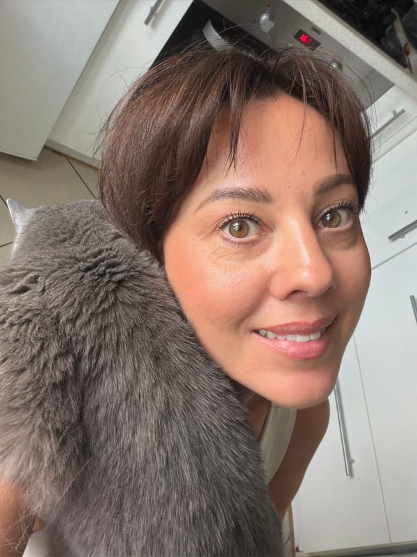 Cozy cat-and-person selfie moment in Riga