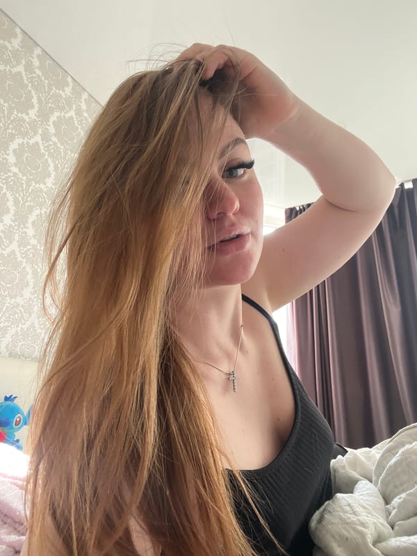 Woman photographed lying down indoors in Sevastopol