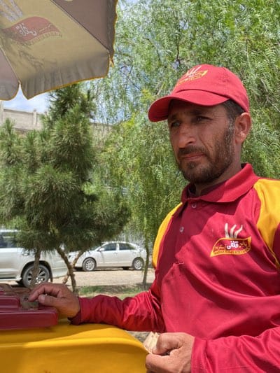 Ice cream vendor operates in Kandahar park