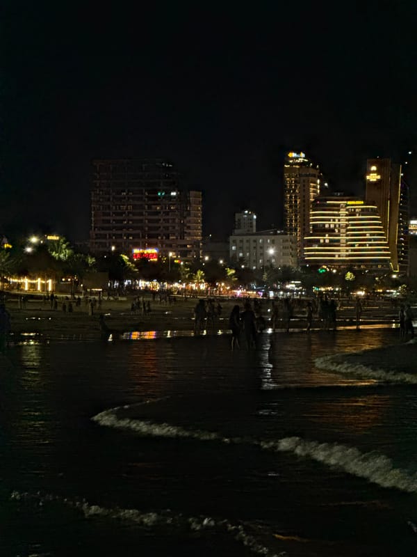 Da Nang beachfront at night, city lights and shoreline activity