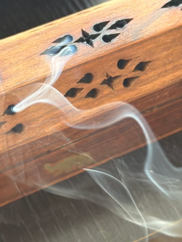 Decorative wooden incense holder burns in Cape Town