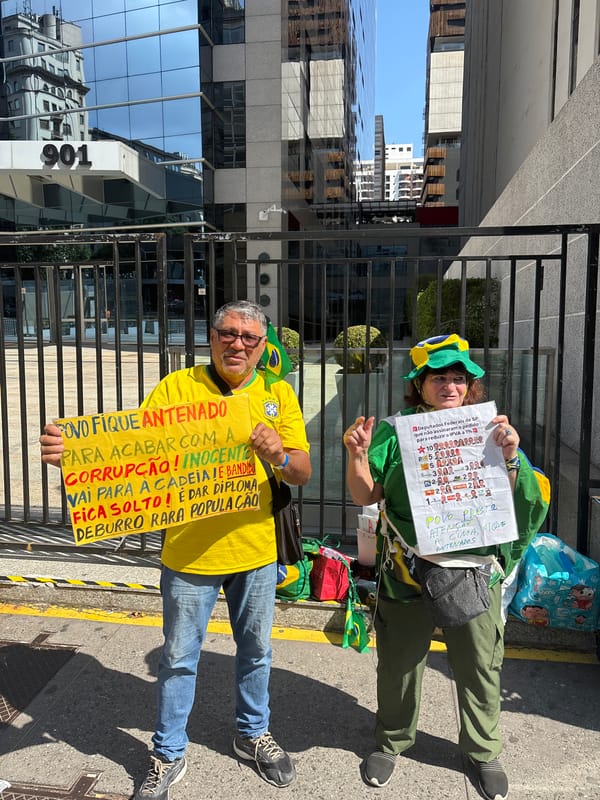 Street demonstration observed in São Paulo amid modern cityscape