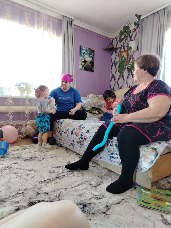 Woman and injured boy observed together in bedroom setting