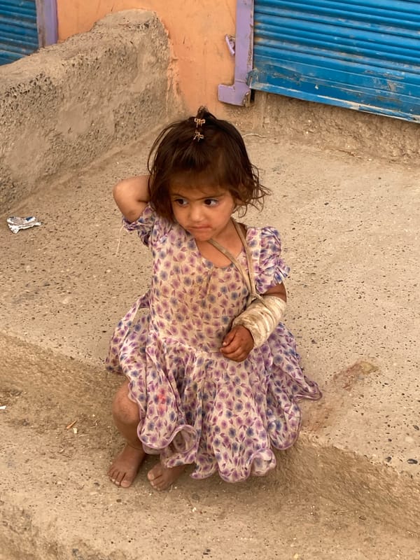 Child observed resting on ground in Loralai, Pakistan