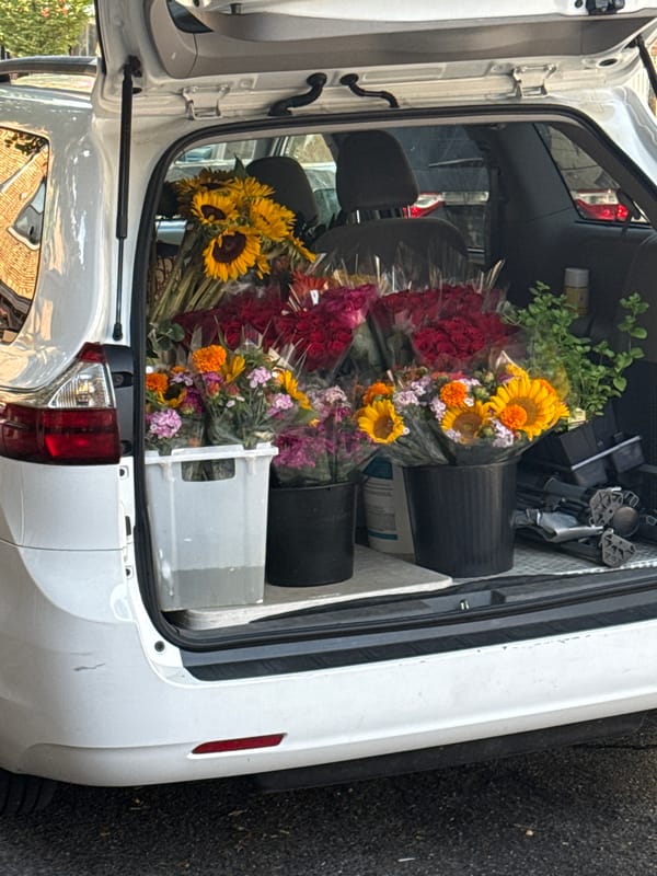 Minivan trunk loaded with fresh flower bouquets in New York