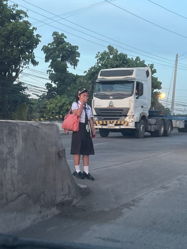 Evening highway scene in Davao City with traffic and street life