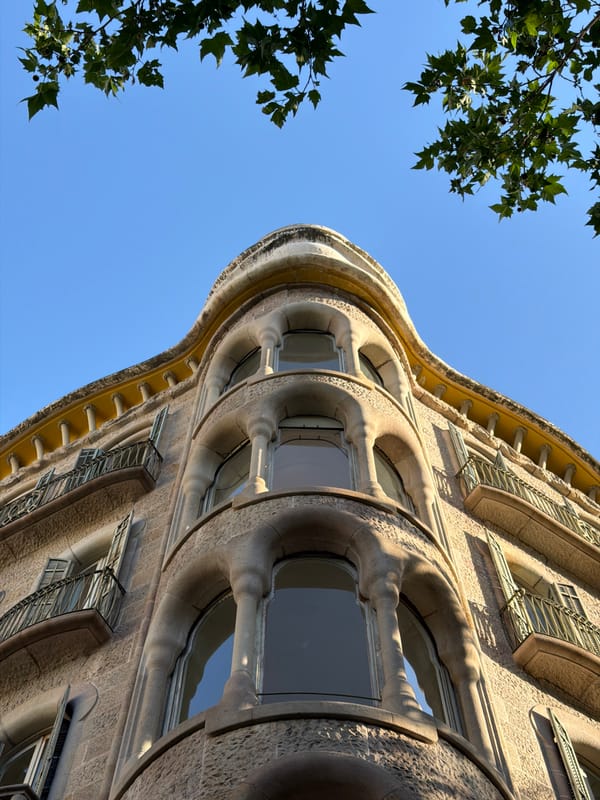 Tourist documents Gaudí architecture tour in Barcelona's Eixample district