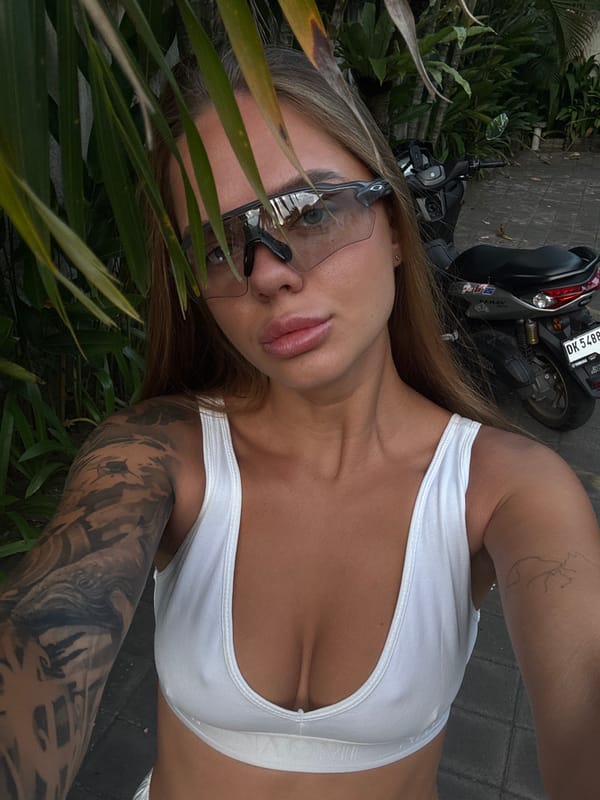 Woman poses with motorcycle during casual photoshoot in North Kuta