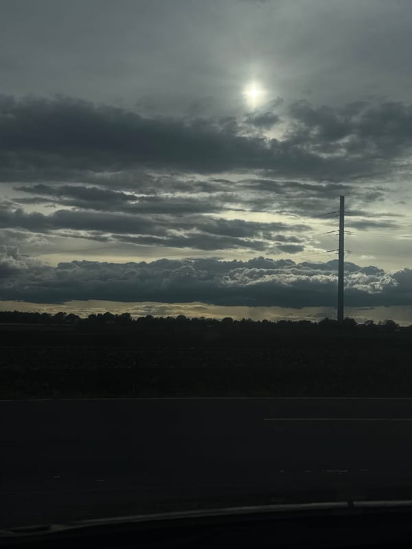 Overcast skies observed over rural area with utility infrastructure