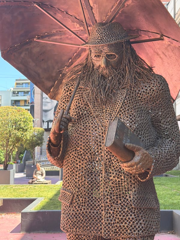 Art sculpture and casual street scene observed in Belgrade