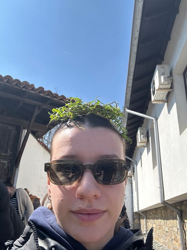 Woman takes crowned selfie in historic Arbanassi, Bulgaria