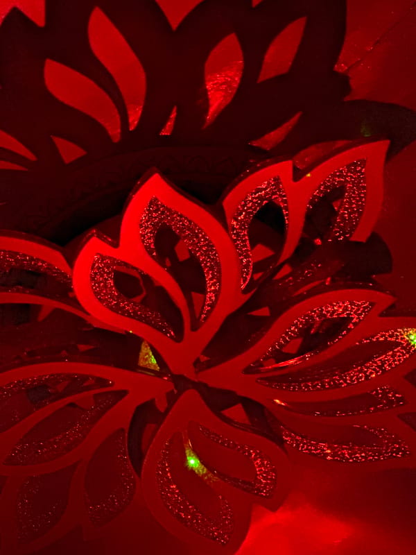 Red glittery decorative ornament photographed in Russian town