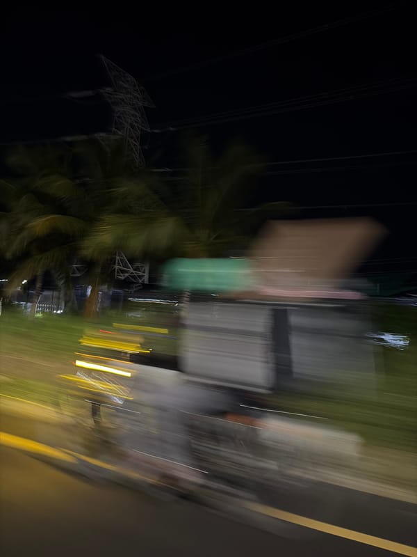 Nighttime car journey observed through Ilado, Nigeria