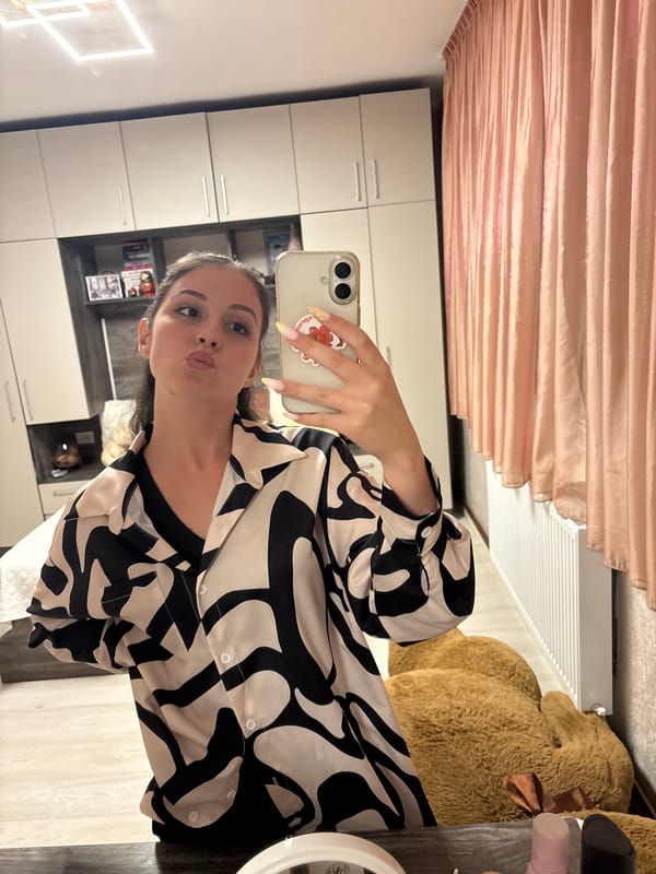 Mirror selfie session in a Bulgarovo bedroom, black and white shirt