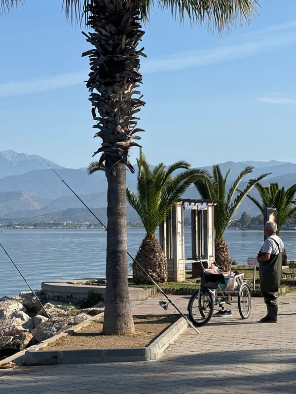 Fisherman tends equipment at Fethiye marina early morning