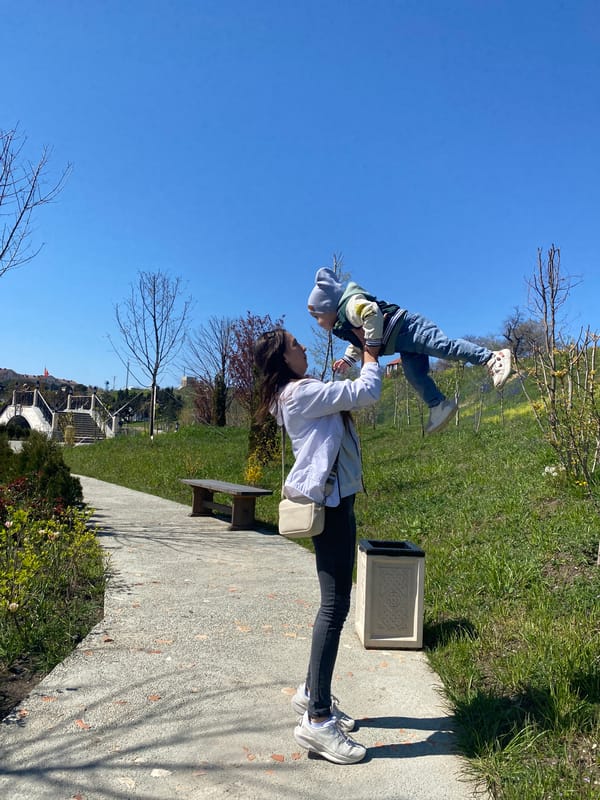 Mother and toddler enjoy sunny morning in Sevastopol park