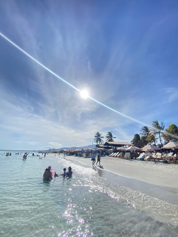 Busy beach afternoon on Margarita Island's turquoise shores