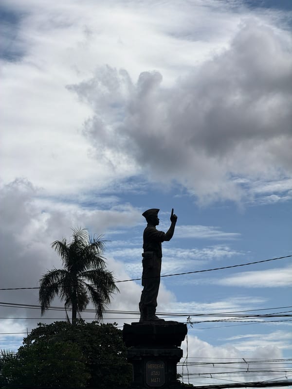Morning traffic and statue observed in Denpasar Indonesia