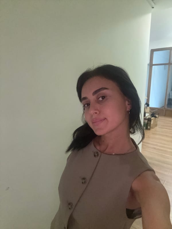 Casual afternoon at a Tbilisi home office, midday July 2026